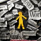illustration of paper person with pieces of paper surrounding it labeled with stressors like work, pandemic, unknown, and more