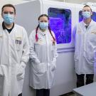 group of people in lab coats and masks